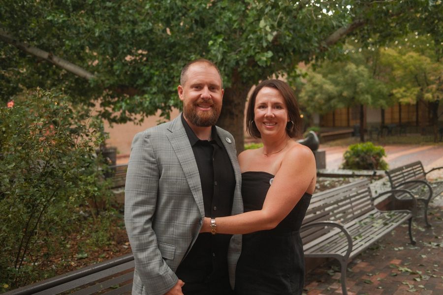 Michael and Lauren Singley, who run The Pantry today, smiling together under a tree in downtown Santa Fe.